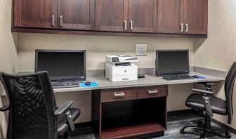 dedicated business center with printers, internet, and work desks at Hampton Inn Cranbury.