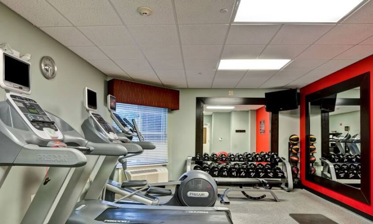 Weights and treadmills at the fitness center of the Homewood Suites by Hilton Bel Air.