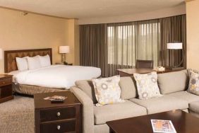 Spacious and comfortable king suite with sofa at the DoubleTree by Hilton Tulsa - Warren Place.