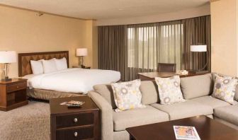 Spacious and comfortable king suite with sofa at the DoubleTree by Hilton Tulsa - Warren Place.