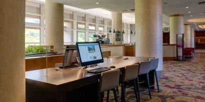 Workstation in a hotel lobby at the DoubleTree by Hilton Tulsa - Warren Place.