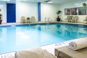 Relaxing indoor pool with lounges at the Hilton Chicago-Northbrook.