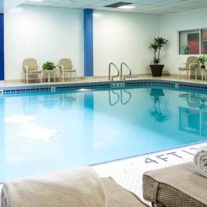 Relaxing indoor pool with lounges at the Hilton Chicago-Northbrook.