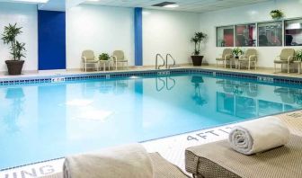 Relaxing indoor pool with lounges at the Hilton Chicago-Northbrook.