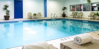 Relaxing indoor pool with lounges at the Hilton Chicago-Northbrook.