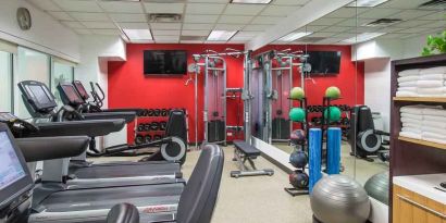 Fitness center with treadmills and machines at the Hilton Chicago-Northbrook.