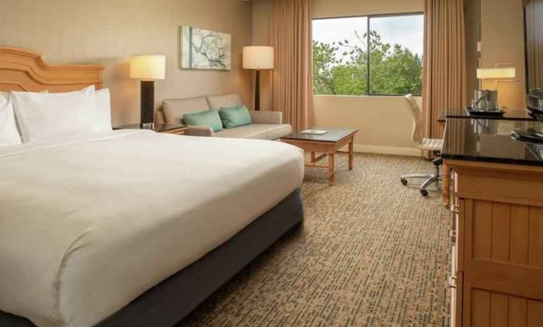 King guestroom with desk and sofa at the DoubleTree by Hilton Sonoma Wine Country.