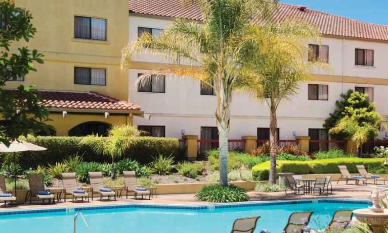 Relaxing pool area with lounges at the DoubleTree by Hilton Sonoma Wine Country.