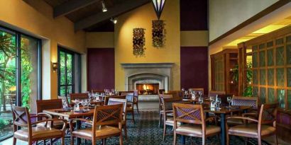 Dining area by the fireplace perfect for co-working at the DoubleTree by Hilton Sonoma Wine Country.