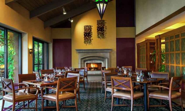 Dining area by the fireplace perfect for co-working at the DoubleTree by Hilton Sonoma Wine Country.