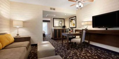 Living room in a hotel suite perfect as workspace at the Embassy Suites by Hilton Napa Valley.