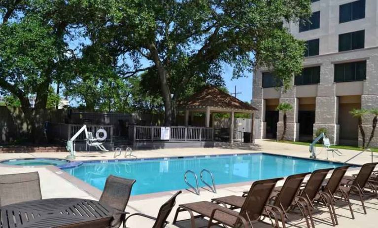 Relaxing outdoor pool area at the Hilton New Orleans Airport.