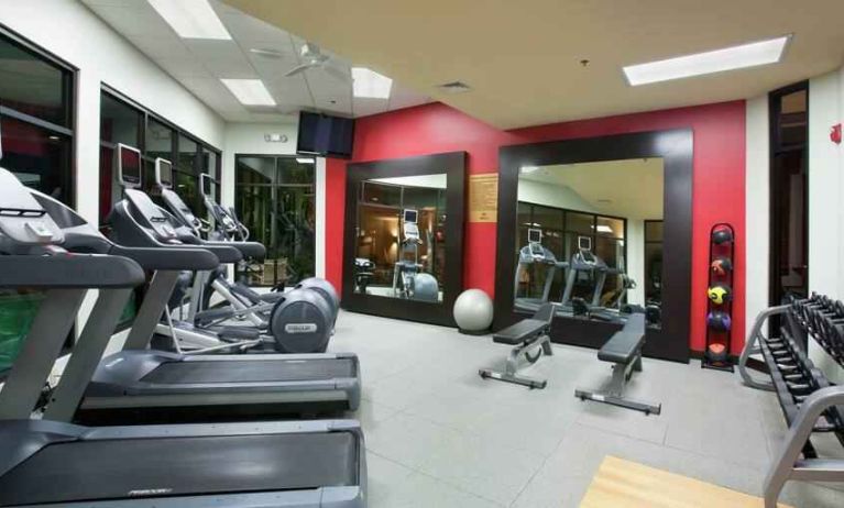 Fitness center with treadmills and weights at the DoubleTree by Hilton Wichita Airport.