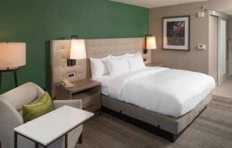 King bedroom with sofa and desk at the Hilton Birmingham at UAB.