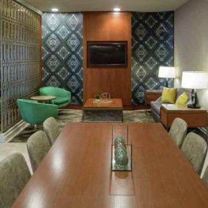 Comfortable hotel workspace with tables and lounges at the Hilton Birmingham at UAB.