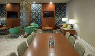 Comfortable hotel workspace with tables and lounges at the Hilton Birmingham at UAB.