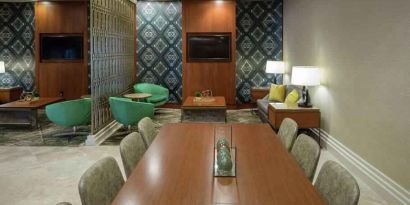 Comfortable hotel workspace with tables and lounges at the Hilton Birmingham at UAB.