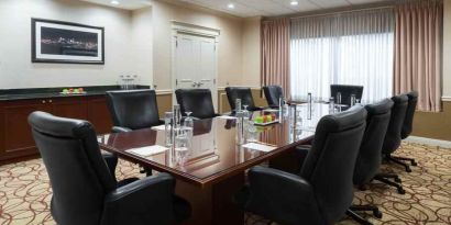 Elegant meeting room with comfortable chairs at the DoubleTree Suites by Hilton Cincinnati-Blue Ash.