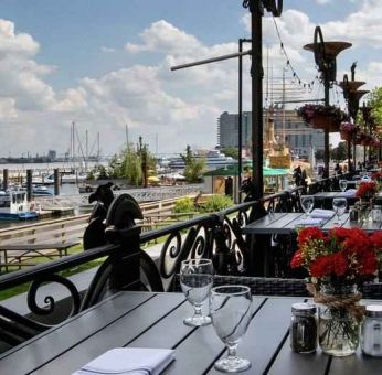 Beautiful outodoor terrace by the water perfect for co-working at the Hilton Philadelphia at Penn's Landing.