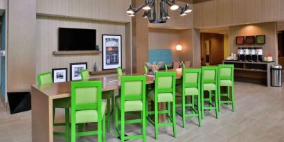 Lobby workspace perfect for co-working at the Hampton Inn & Suites St. Paul Oakdale/Woodbury by Hilton.