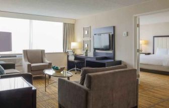 King suite with living room and bedroom at the DoubleTree by Hilton Rochester.