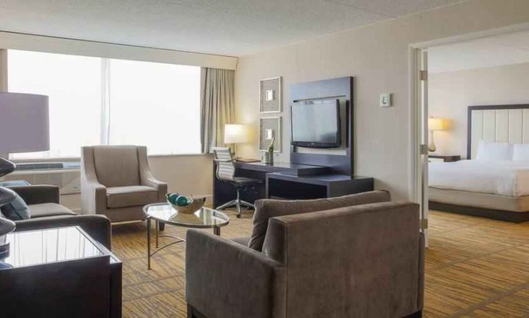 King suite with living room and bedroom at the DoubleTree by Hilton Rochester.