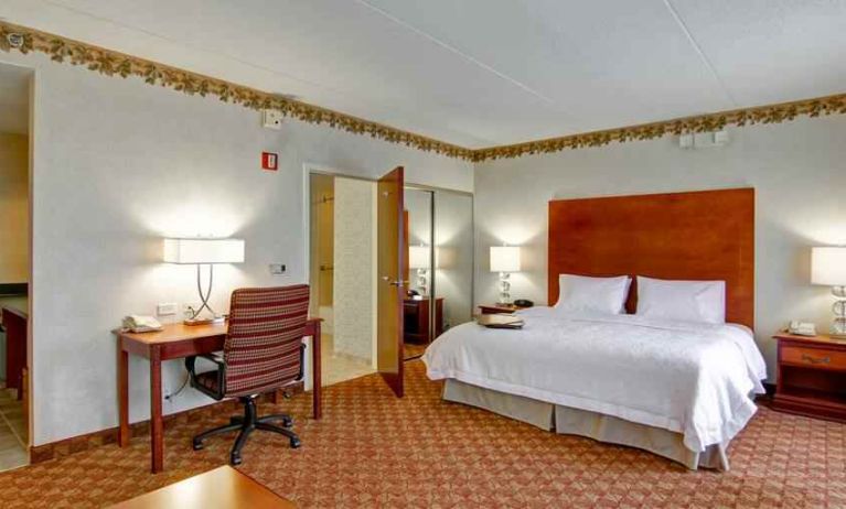 King bedroom with desk at the Hampton Inn & Suites Leesburg.