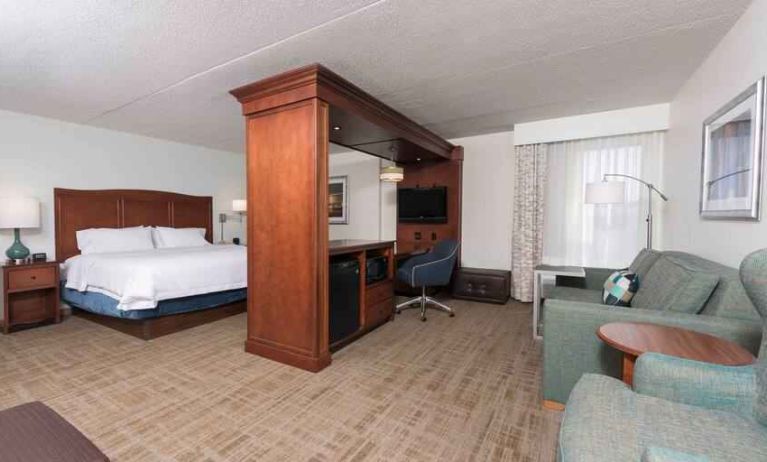 King suite with working station at the Hampton Inn Grand Rapids North.