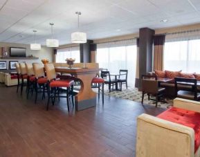 Spacious lobby workspace perfect for co-working at the Hampton Inn Grand Rapids North.