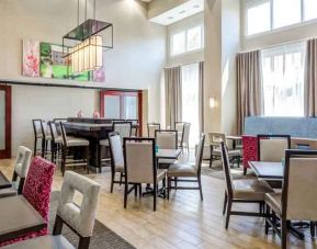 Bright lobby workspace perfect for co-working at the Hampton Inn & Suites Westford-Chelmsford.