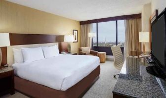 Comfortable king size bed in a hotel guestroom at the DoubleTree by Hilton Washington DC - Crystal City.