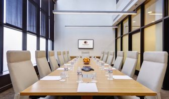 Small meeting room with TV screen at the DoubleTree by Hilton Washington DC - Crystal City.