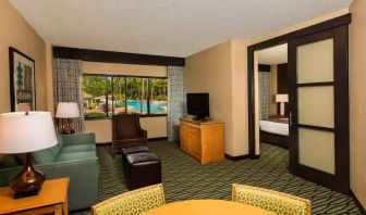 Spacious living room with working station at the DoubleTree Suites by Hilton Orlando - Disney Springs Area.