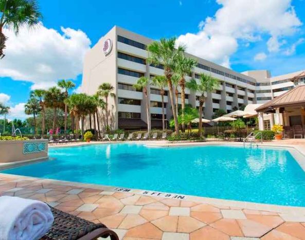 Relaxing outdoor pool at the DoubleTree Suites by Hilton Orlando - Disney Springs Area.