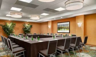 Meeting room with square conference table at the DoubleTree Suites by Hilton Orlando - Disney Springs Area.