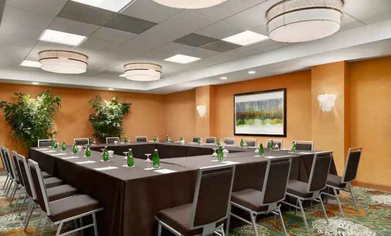 Meeting room with square conference table at the DoubleTree Suites by Hilton Orlando - Disney Springs Area.