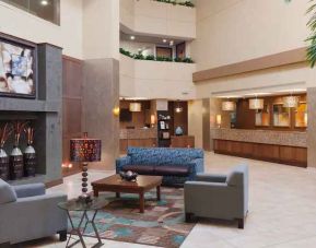 Comfortable lobby workspace with sofas at the DoubleTree Suites by Hilton Orlando - Disney Springs Area.