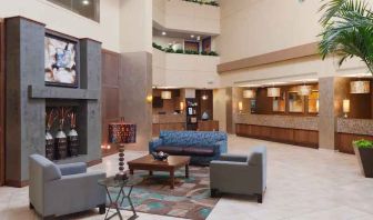 Comfortable lobby workspace with sofas at the DoubleTree Suites by Hilton Orlando - Disney Springs Area.