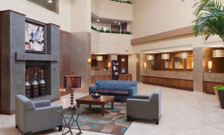 Comfortable lobby workspace with sofas at the DoubleTree Suites by Hilton Orlando - Disney Springs Area.