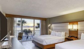 Double queen bedroom with view and balcony at the DoubleTree Beach Resort by Hilton Tampa Bay - North Redingto.