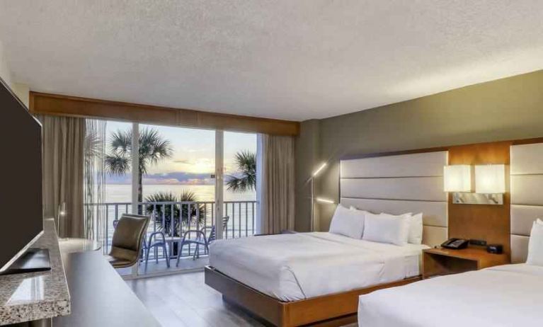 Double queen bedroom with view and balcony at the DoubleTree Beach Resort by Hilton Tampa Bay - North Redingto.