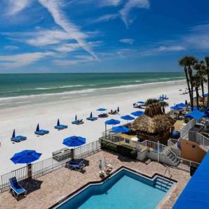 Beautiful outdoor space with pool along the hotel beach at the DoubleTree Beach Resort by Hilton Tampa Bay - North Redingto.