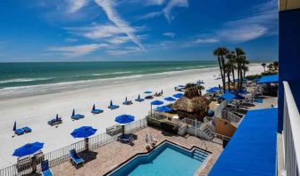 Beautiful outdoor space with pool along the hotel beach at the DoubleTree Beach Resort by Hilton Tampa Bay - North Redingto.