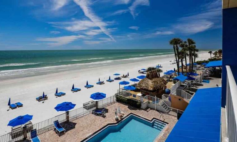 Beautiful outdoor space with pool along the hotel beach at the DoubleTree Beach Resort by Hilton Tampa Bay - North Redingto.