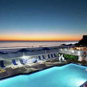 Outdoor pool overlooking the beach at the DoubleTree Beach Resort by Hilton Tampa Bay - North Redingto.