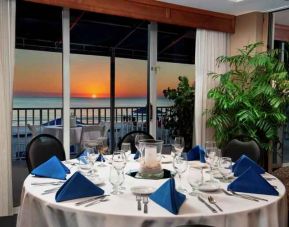 Dining area overlooking the water perfect as workspace at the DoubleTree Beach Resort by Hilton Tampa Bay - North Redingto.