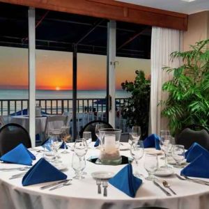 Dining area overlooking the water perfect as workspace at the DoubleTree Beach Resort by Hilton Tampa Bay - North Redingto.