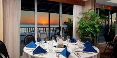 Dining area overlooking the water perfect as workspace at the DoubleTree Beach Resort by Hilton Tampa Bay - North Redingto.