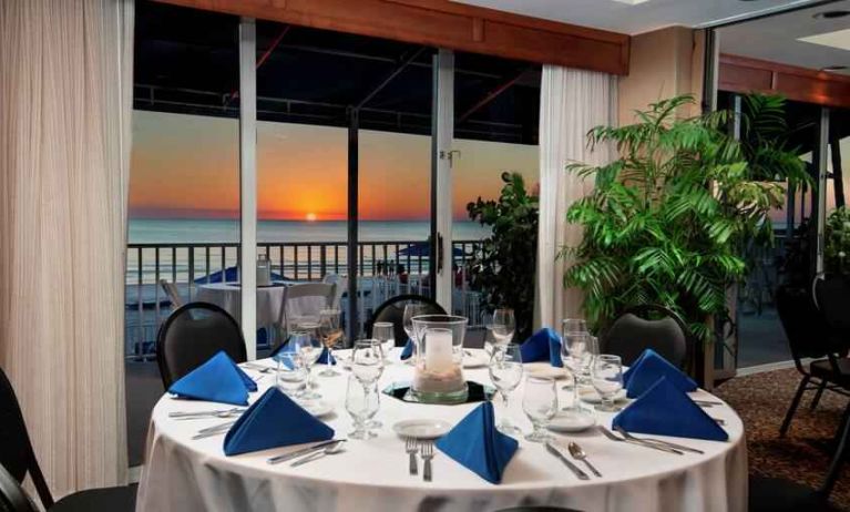 Dining area overlooking the water perfect as workspace at the DoubleTree Beach Resort by Hilton Tampa Bay - North Redingto.