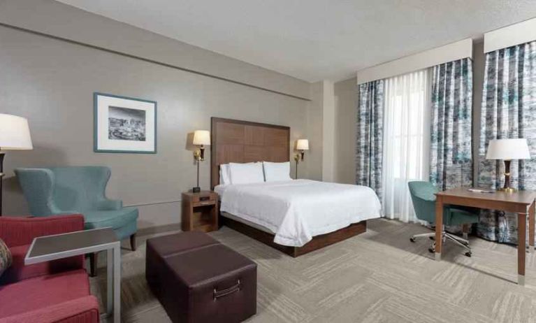 Spacious king suite with desk by the window at the Hampton Inn Indianapolis Dwtn Across from Circle Centre.